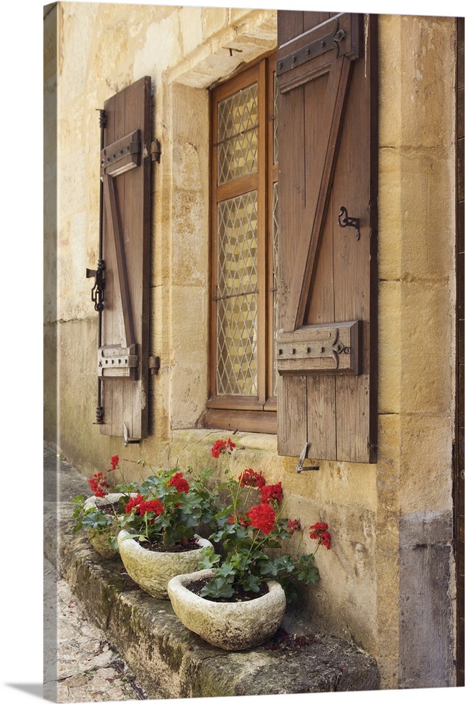 Colorful window boxes photographed in the Dordogne region of France.