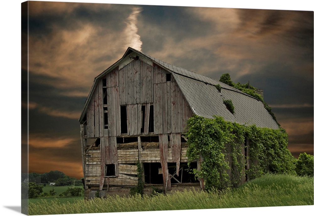 Dilapidated old barn with sunset sky.
