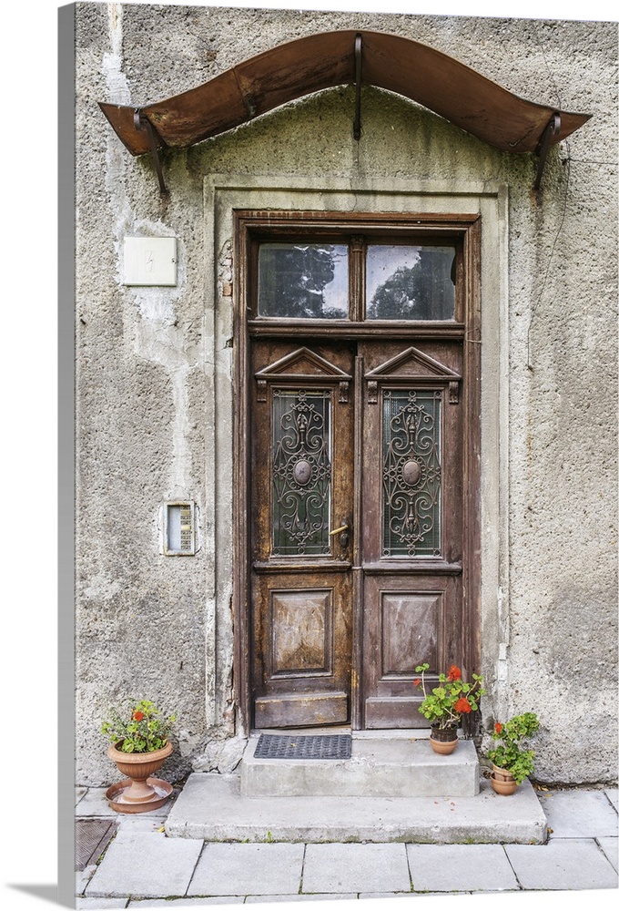 Old door in an ancient European stone house.