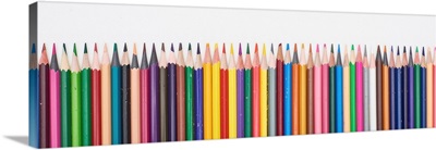 Panoramic Shot Of Straight Line Of Color Pencils Isolated On White
