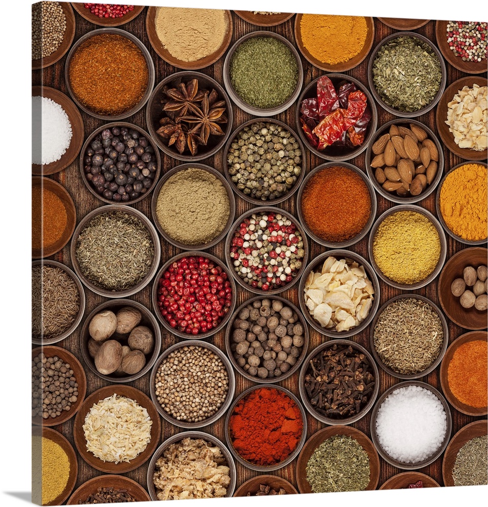 Various kinds of spices on wooden table.