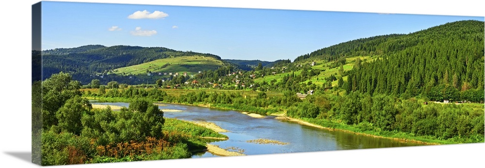 Carpathian mountain summer landscape with river, sky, and clouds.