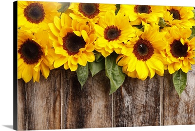 Sunflowers On Wooden Background