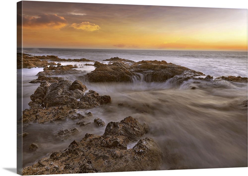 Thors well at Cooks chasm by Cape Perpetua on the Oregon coast during colorful sunset.