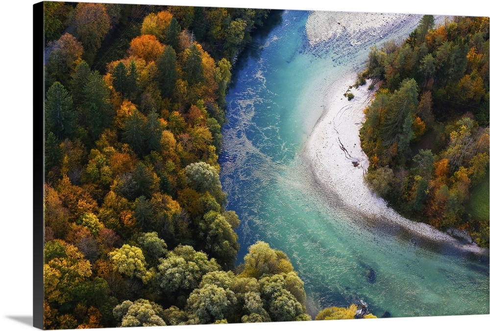 Pristine alpine turquoise river meandering through forested landscape in a sunny autumn day, aerial view. Pristine, clean ...