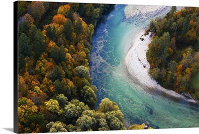 Turquoise River Meandering Through Forested Landscape