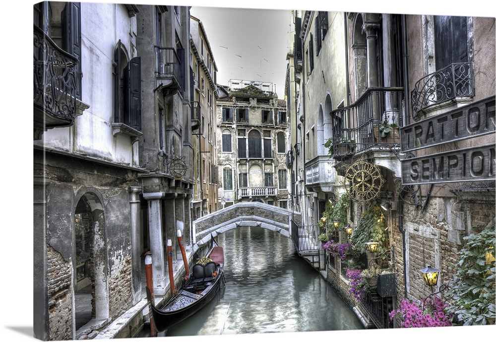 Small bridge and gondola in Palazzi, Venice, Italy.