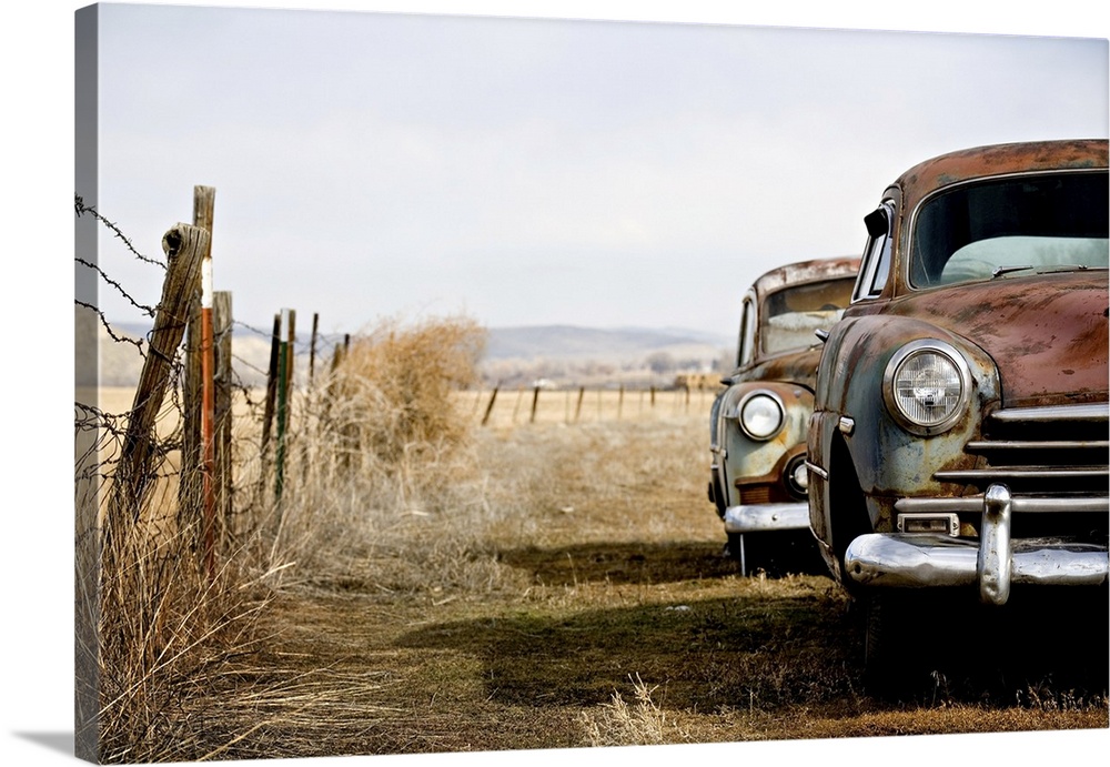 Vintage cars abandoned and rusting away in rural Wyoming.