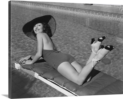 Woman Sunbathing At Pool