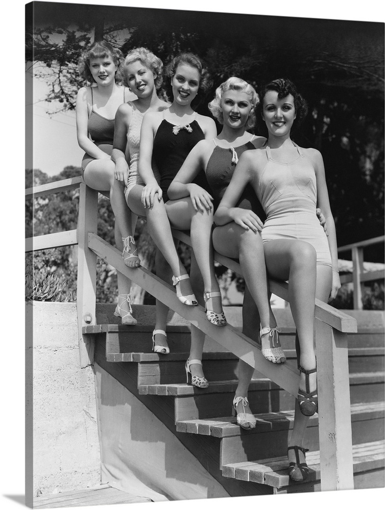 Women posing in bathing suits.