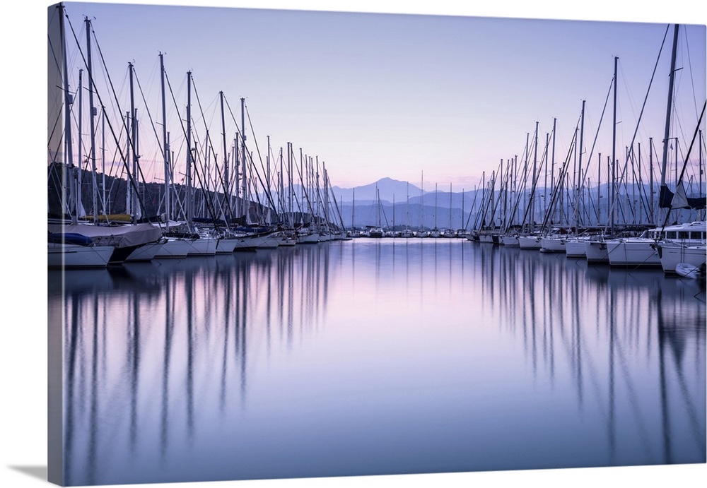 Large yacht harbor in purple sunset light, luxury summer cruise, sailboats in sunrise, leisure time, active life, vacation...
