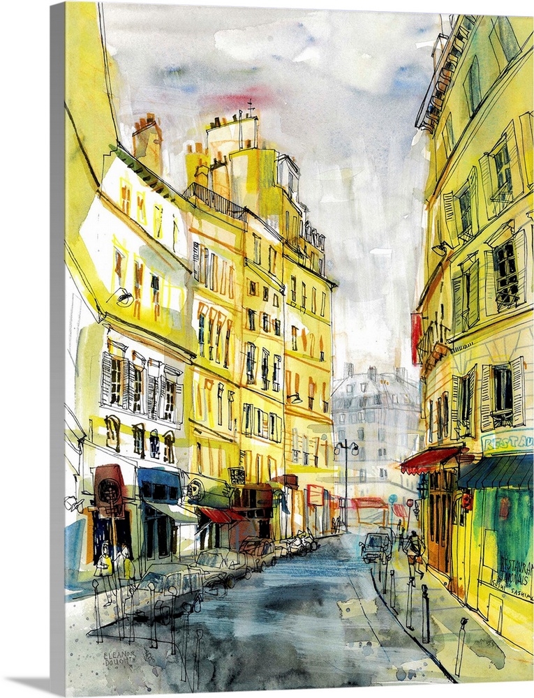 A typical Parisian street of tall, elegant buildings painted in delicate shades of yellow and cream colors. This one is in...