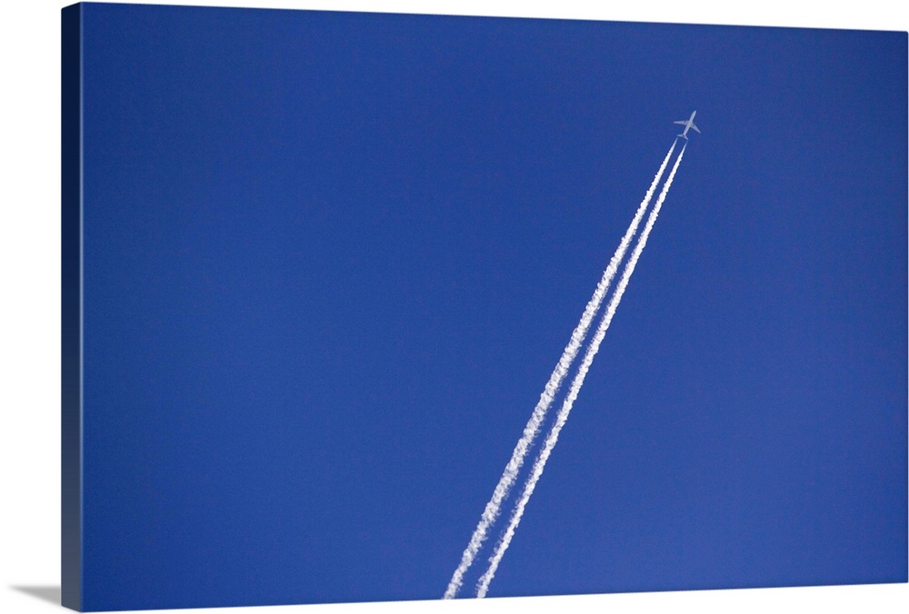Airplane and vapor trail