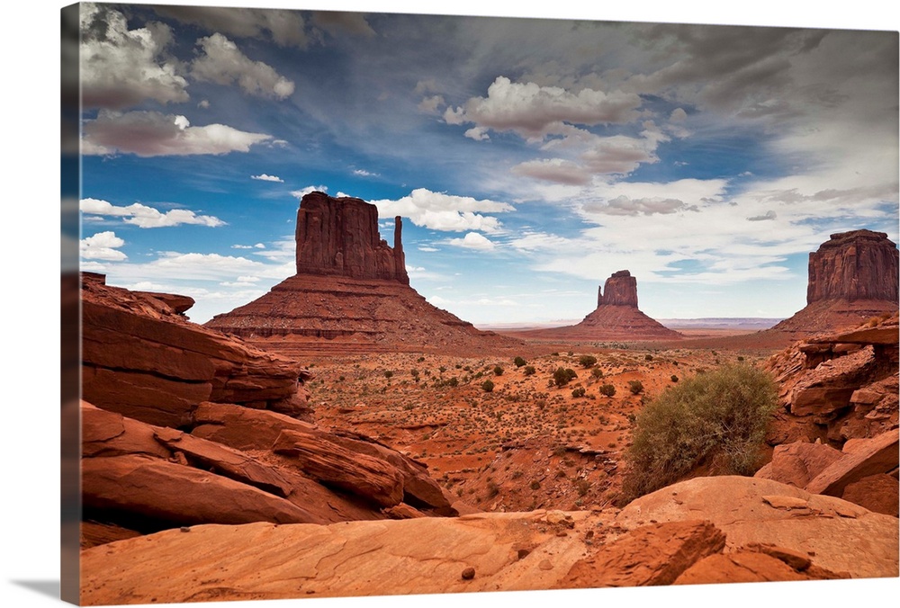 USA, Arizona, Monument Valley Tribal Park, Monument Valley, Navajo Nation sandstone mesas and buttes with impending sandst...