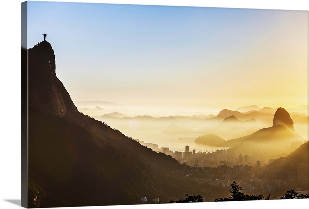 Brazil, Rio de Janeiro, Corcovado, Christ the Redeemer, City at sunrise with Corcovado, Cristo Redentor and Sugarloaf Moun...