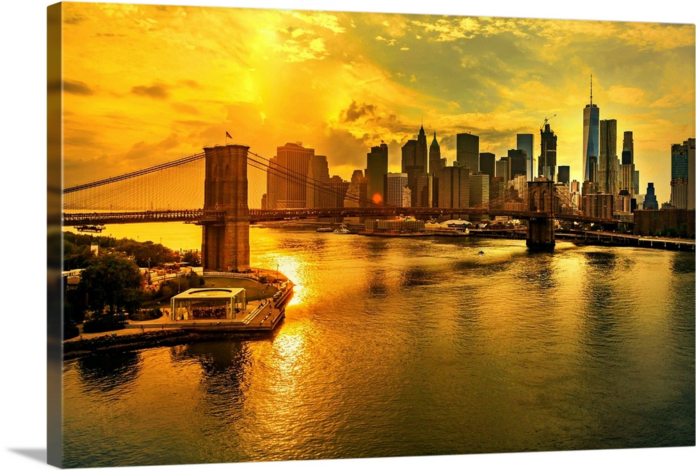 New York City, Manhattan, East River, Lower Manhattan, Brooklyn Bridge, Downtown and Financial District skyline at sunset,...