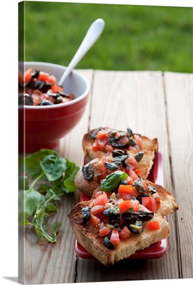 Bruschetta with tomatoes, olives and capers