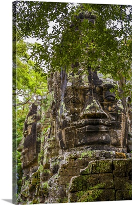 Cambodia, Giant Stone Faces At One Of The Gates Inside The Angkor Thom Temple Complex