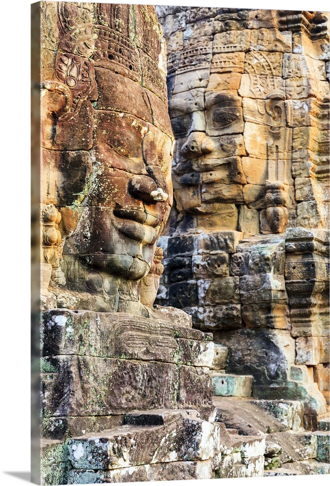 Cambodia, Siemreab, Angkor, Carved Buddha faces in the Bayon Temple.