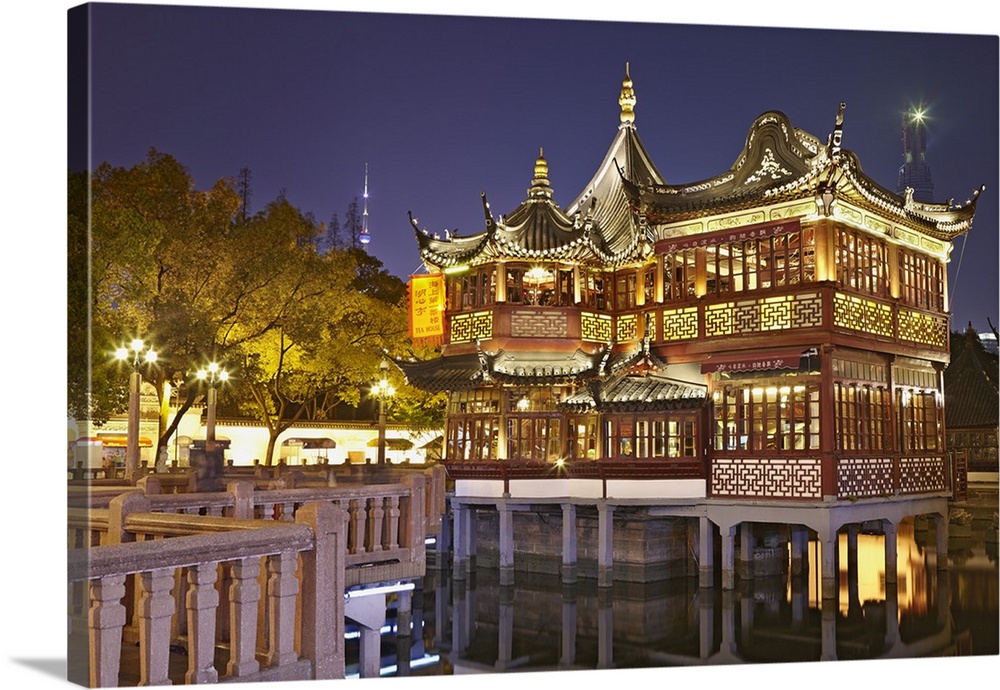 China, Shanghai, Huxinting Teahouse illuminated at night, Yuyuan Gardens.