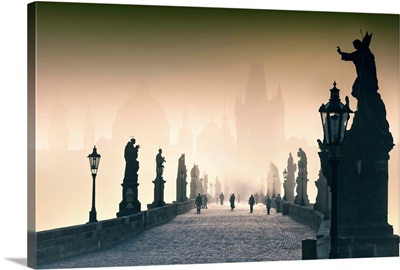 Czech Rep, Prague, Charles Bridge, People walking on Charles bridge on a foggy morning