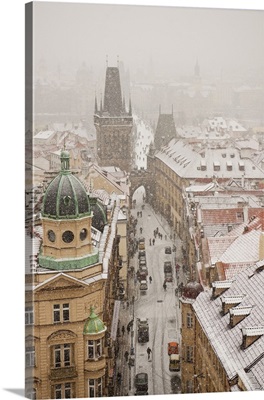 Czech Republic, Prague, Bohemia, Town under snow from St Nicholaus Church bell tower