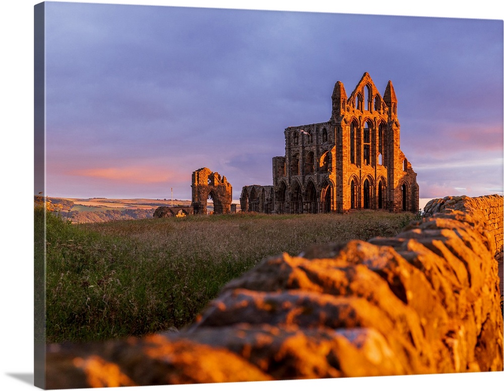 England, North Yorkshire, Whitby, Great Britain, British Isles, Sunrise over the gothic ruins of Whitby Abbey, a Benedicti...