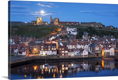 England, North Yorkshire, Whitby, view across the town towards the abbey at night