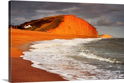 English Channel, Dorset, View of the red limestone cliffs at West Bay, near Bridport
