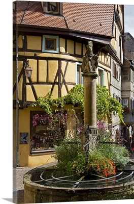 France, Alsace, Riquewihr, Haut-Rhin, Picturesque fountain in the village centre