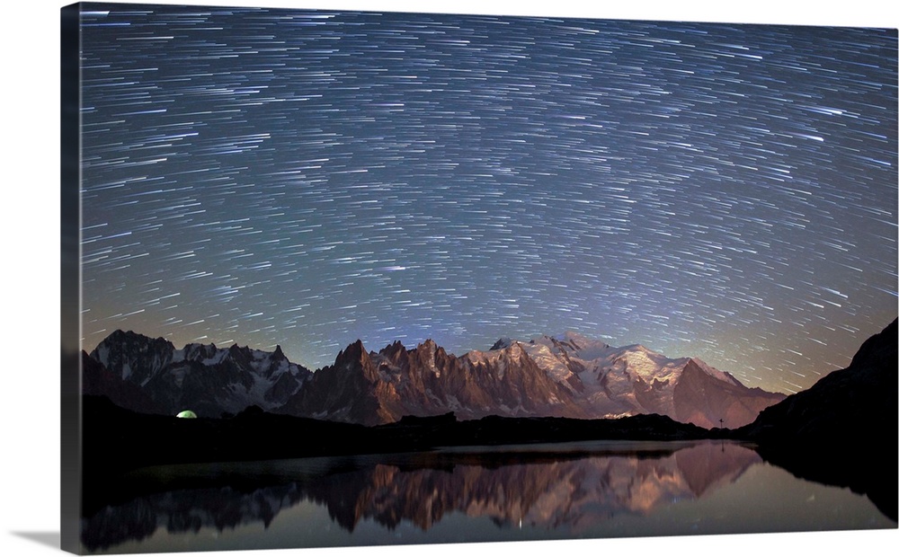 France, Auvergne-Rhone-Alpes, Mont Blanc, Startrail over Mont Blanc range seen from Lac de Chesery.