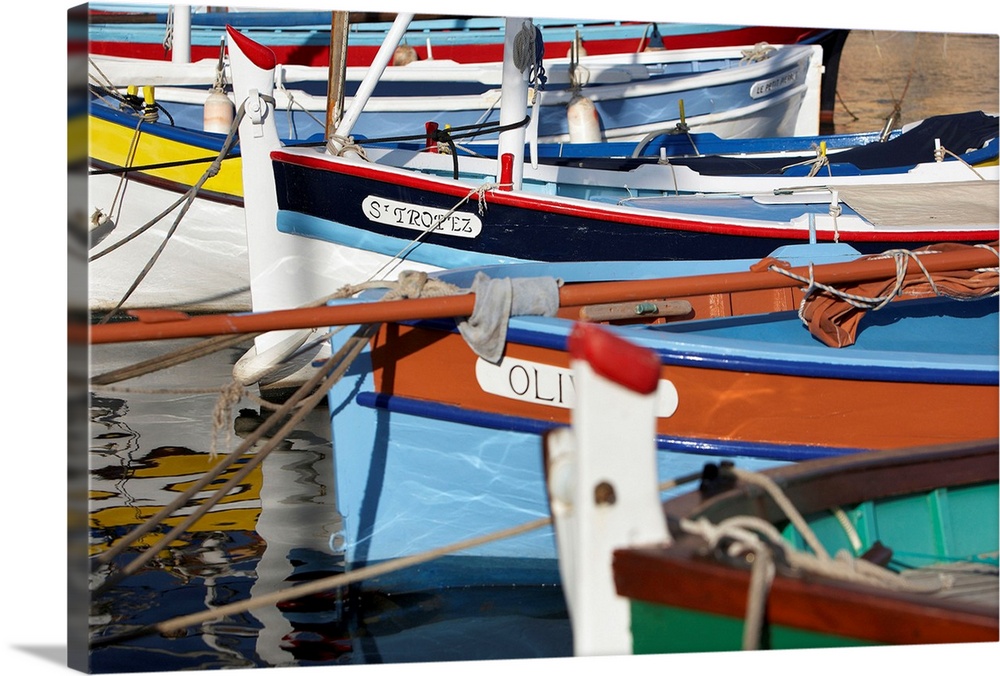 France, Cote d'Azur, Saint-Tropez, Traditional fishing boats in the harbor.