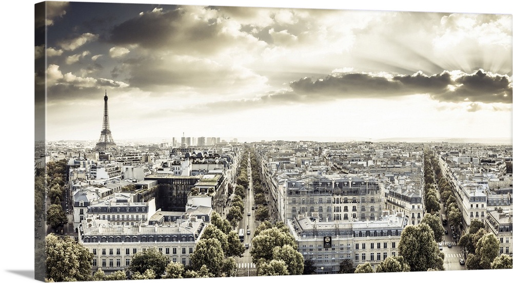 France, Paris, Champs Elysees, Cityscape from the Arc de Triomphe, Eiffel Tower in the background at sunset.