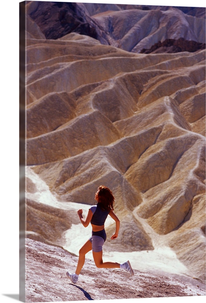 Girl running on desert in Death Valley