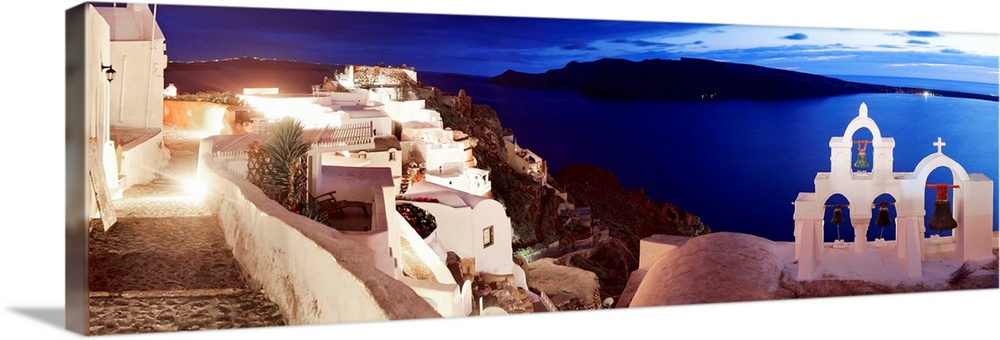 Greece, Aegean islands, Cyclades, Santorini island, Greek Islands, Oia village illuminated at night.