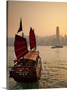 Hong Kong, Traditional junk in the Victoria Harbor with the city skyline image thumbnail