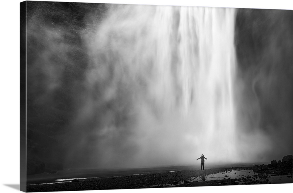Iceland, South Iceland, Skogar, Young woman at Skogar waterfall.