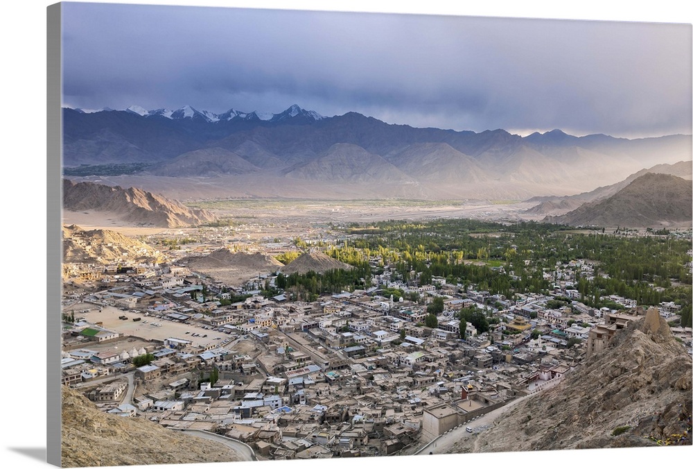 India, Jammu and Kashmir, Ladakh, Cityscape with Leh Palace is in the foreground on the right.