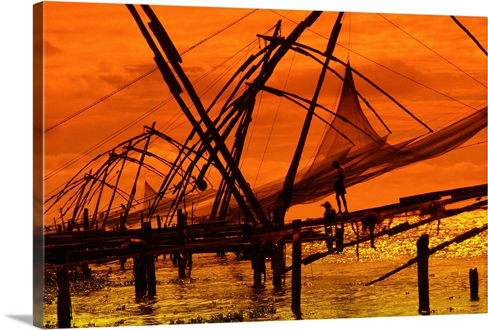 India, Kerala, Fishing net at sunset