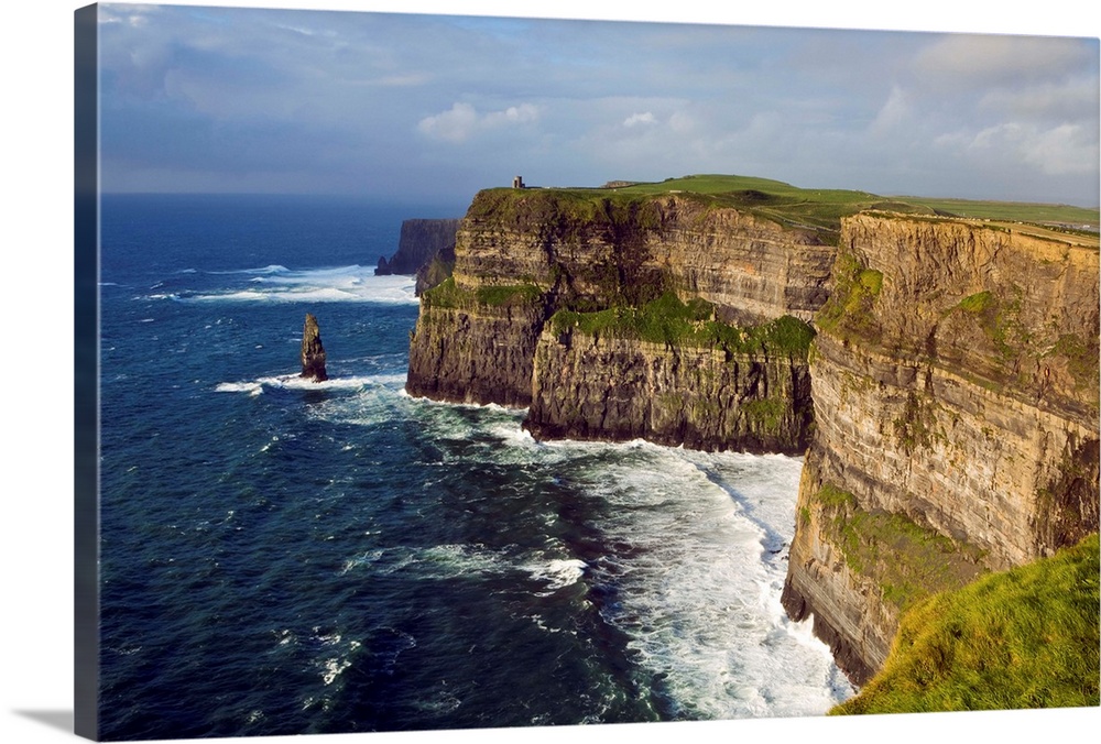 Ireland, Clare, waves generated by Atlantic Ocean storms pound base of Cliffs of Moher