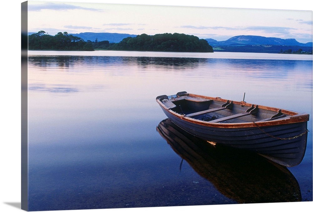 Ireland, Sligo, Lough Gill, boat at rest along the shore of the lake