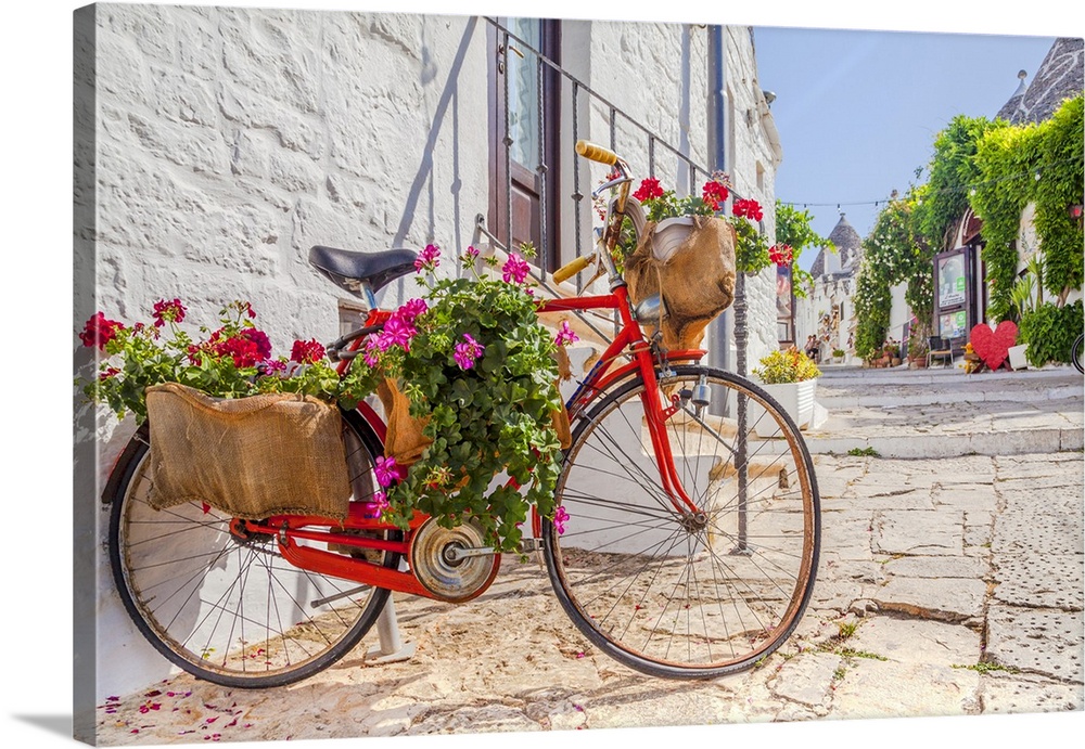 Italy, Apulia, Bari district, Itria Valley, Alberobello, Bicycle in a typical street of Alberobello.