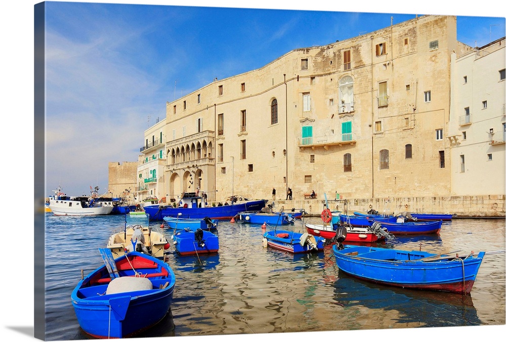 Italy, Apulia, Monopoli, Fishing boats along the harbor.