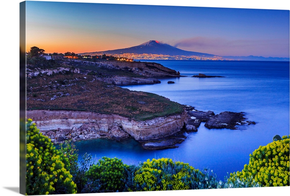 Italy, Sicily, Mediterranean sea, Siracusa district, Augusta, Capo Santa Croce Bay with Catania and Mount Etna erupting in...