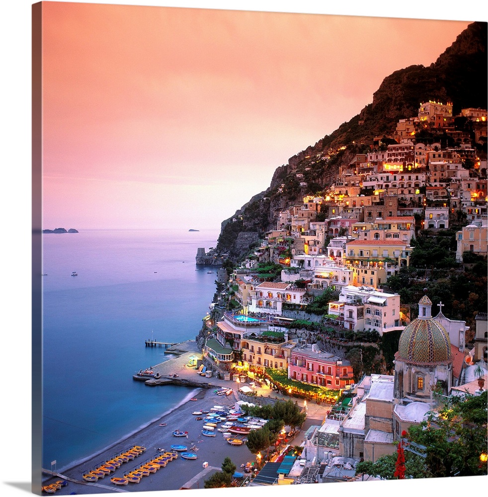 A square shaped photograph of the charming Italian town of Positano at sunset. Built into the cliffs overlooking the Medit...