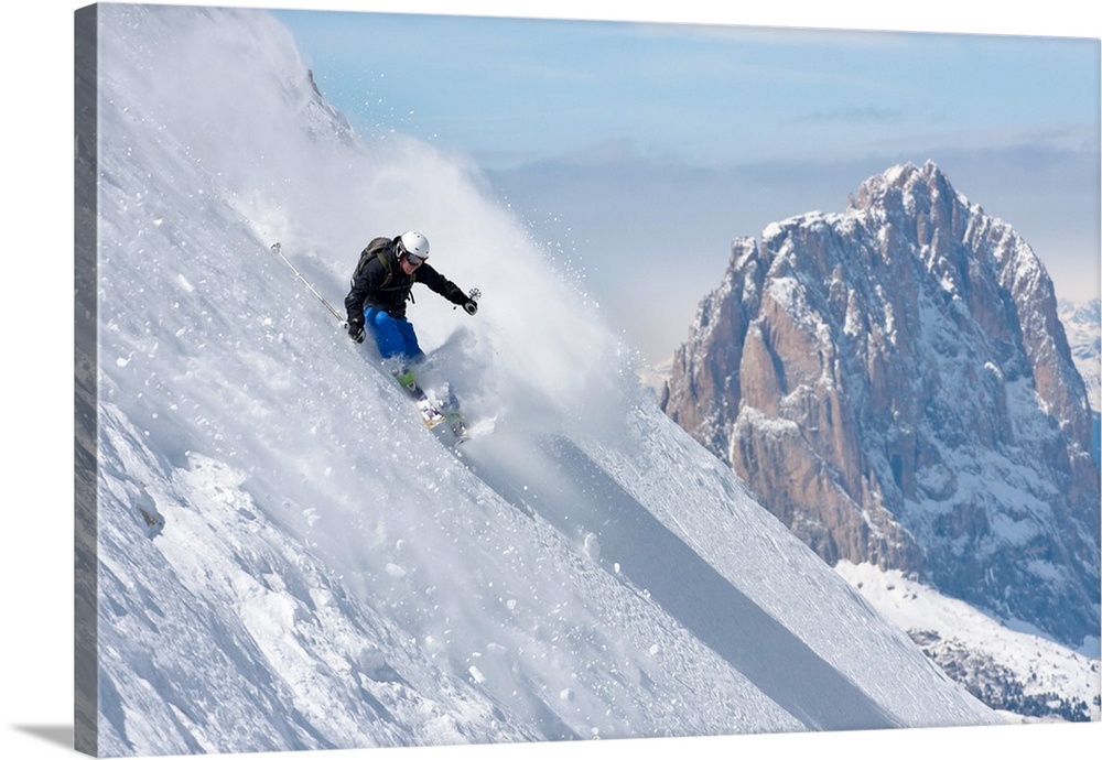 Italy, Veneto, Alps, Dolomites, Belluno district, Freeride ski in Marmolada with Sassolungo Mountain in the background.