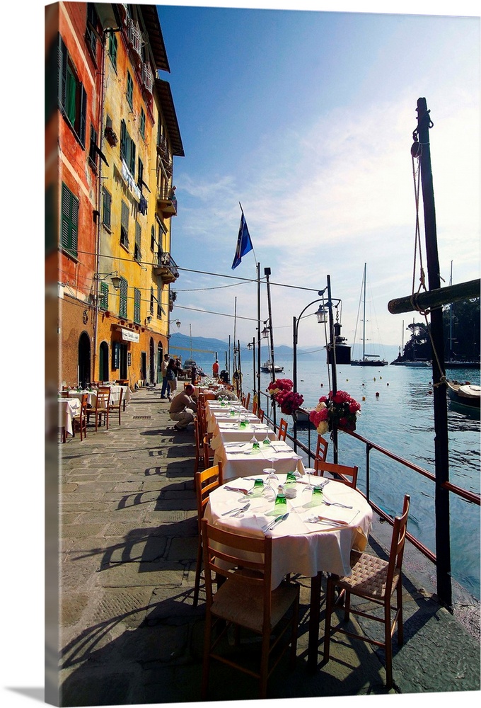 Italy, Liguria, Portofino, Tables along the harbor side.