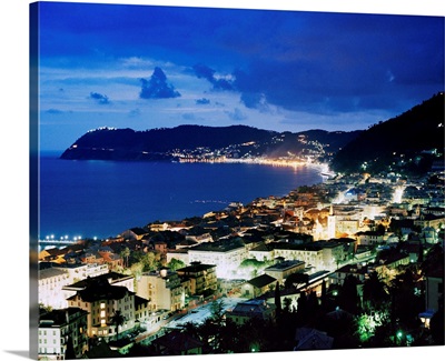Italy, Liguria, Riviera di Ponente, Alassio, view over the bay by night