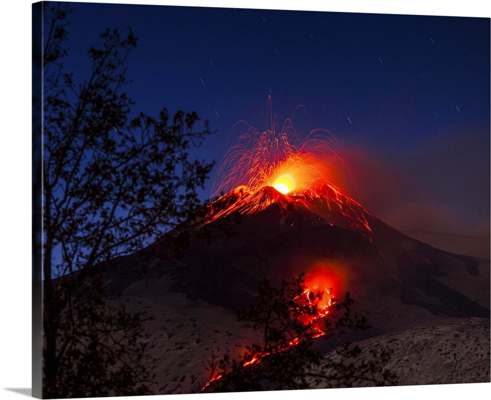 Italy, Sicily, Catania district, Mount Etna, South-east crater eruption at night, lava flowing towards Valle del Bove.