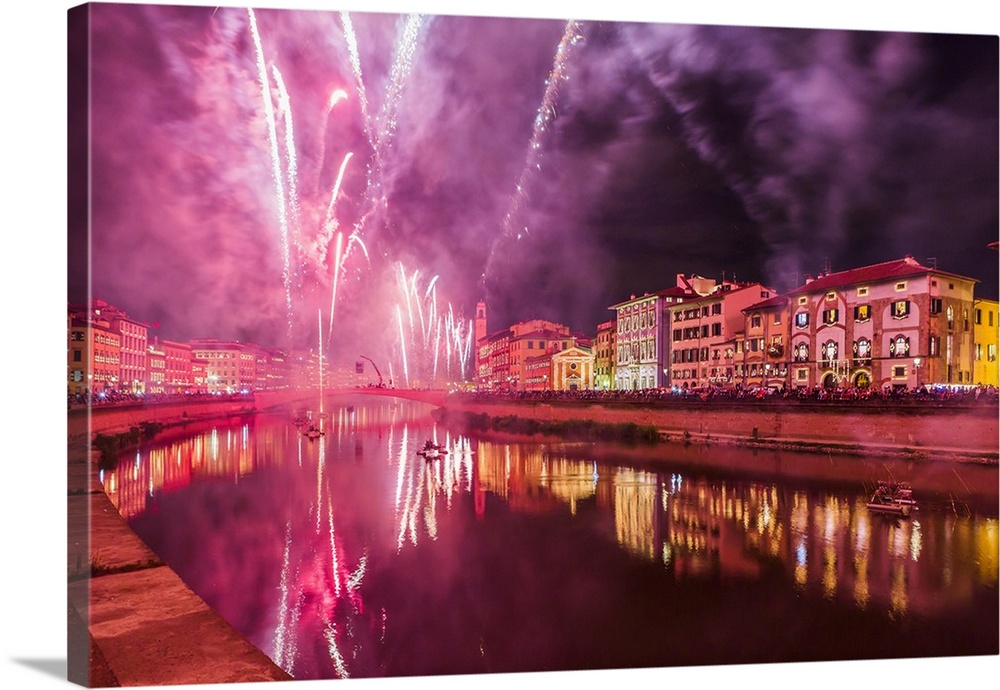 Italy, Tuscany, Pisa district, Pisa, Fireworks at the Arno River waterfront during the Luminara di San Ranieri (Candleligh...